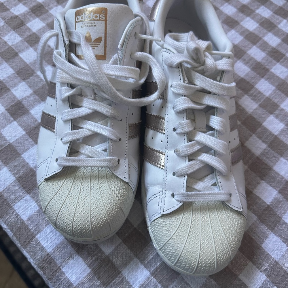 Adidas White Sneakers with Gold Stripes